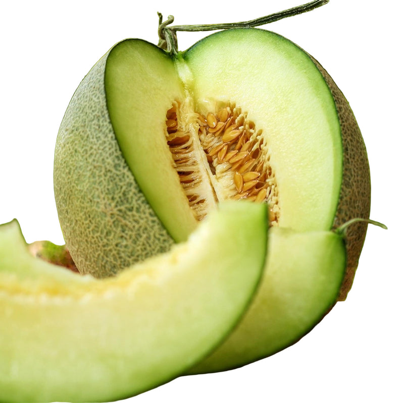 Halved melon on a wooden surface with a blurred green background