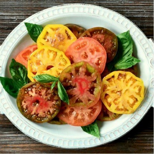 This is our tomato rainbow set. Each seeds is packet individually and has 10 seeds in it.

Plant two a year of each variety for five years worth of tomatoes. If you want to save pure seed then plant each variety at least 25 feet apart. There is the potential to produce thousands of seeds.


Or just plant next to each other and see what develops from the seeds.

Or just plant to eat, can and not worry about the seeds. 