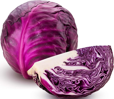 Purple cabbage with a cut half on a white background